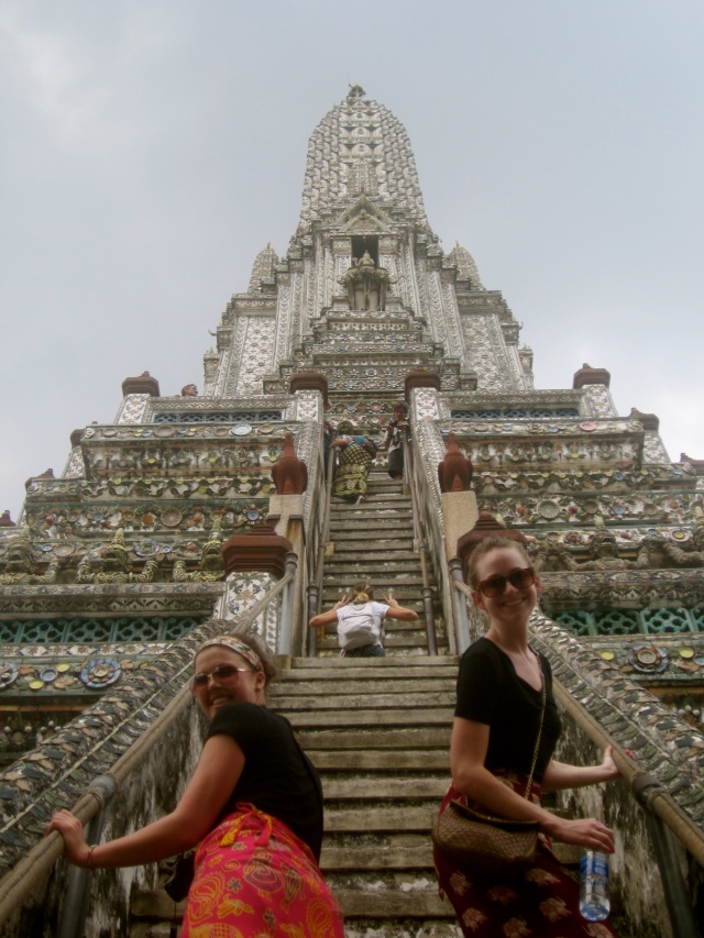 Girls climbing up Wat Arun or Temple of Dawn